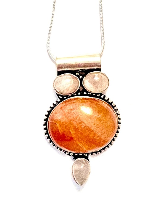 Jewelry - 925 marked, 2 inch, Carnelian and Rose Quartz Pendant on a silver chain.